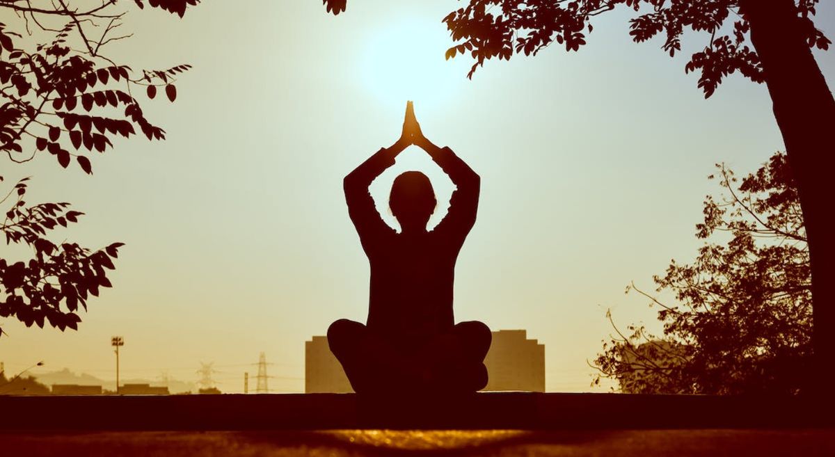 Person practicing yoga in nature